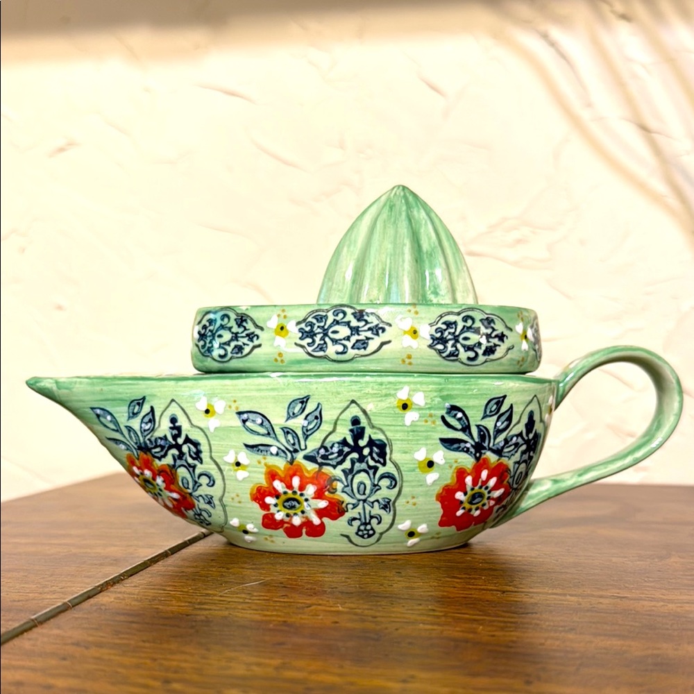 Vintage Anthropologie mint porcelain citrus juicer with floral design.